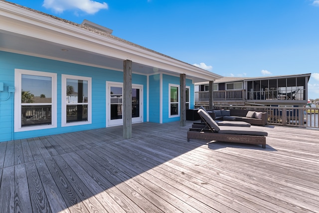 wooden terrace featuring outdoor lounge area