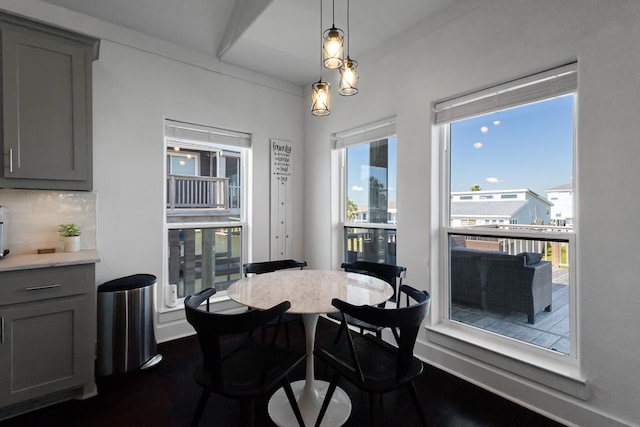 dining space with dark wood-type flooring