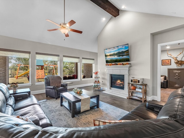 living room with hardwood / wood-style flooring, ceiling fan, beam ceiling, and high vaulted ceiling