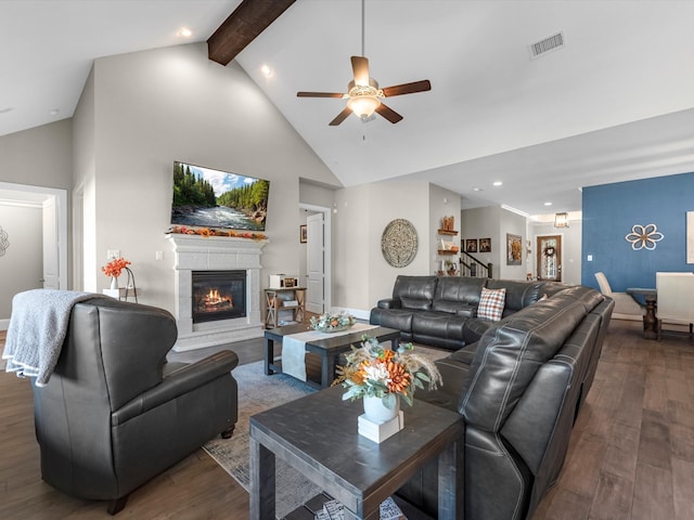 living room with beamed ceiling, ceiling fan, dark hardwood / wood-style flooring, and high vaulted ceiling