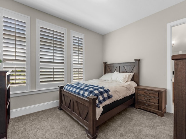 bedroom featuring light carpet