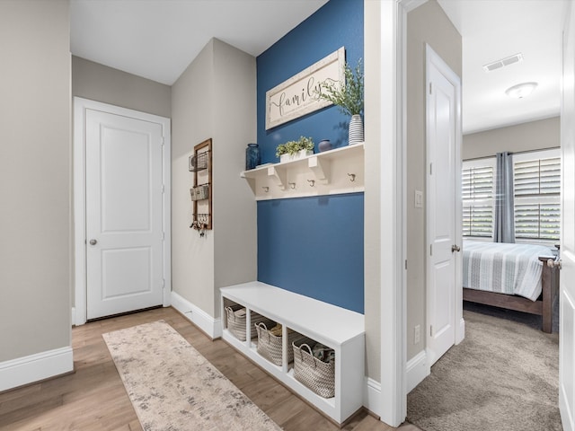 mudroom with hardwood / wood-style floors