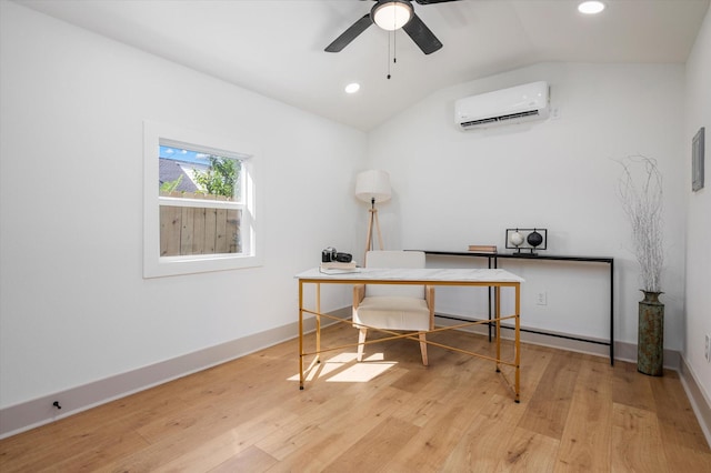 home office featuring an AC wall unit, ceiling fan, light hardwood / wood-style floors, and vaulted ceiling