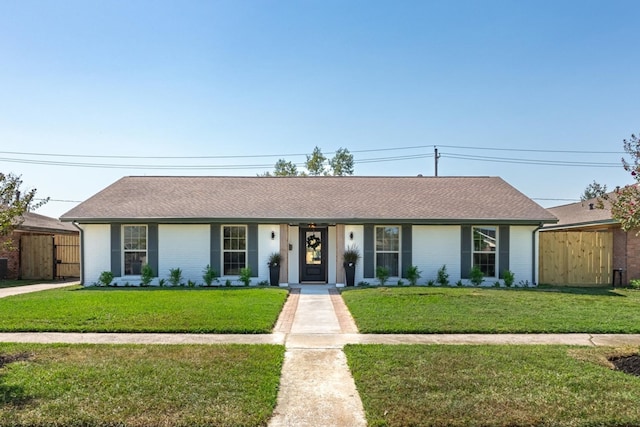 ranch-style house with a front lawn