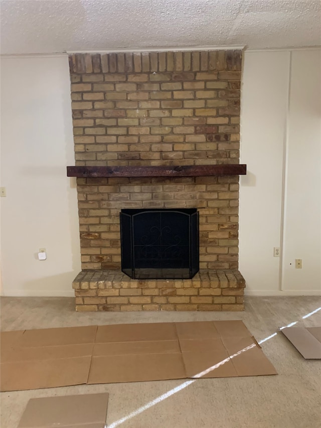 details with a textured ceiling, a fireplace, and tile patterned floors