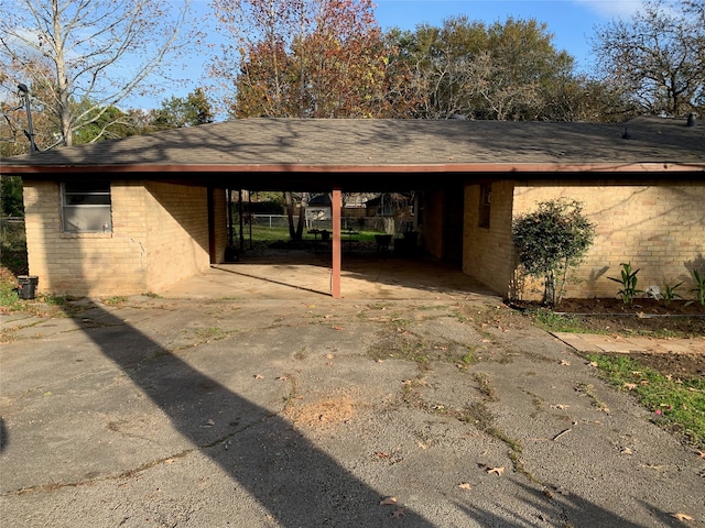 view of parking / parking lot with a carport