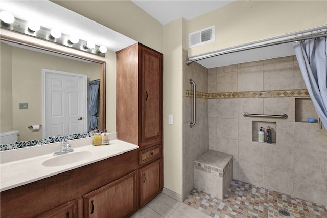 bathroom featuring vanity, a shower with curtain, and tile patterned floors