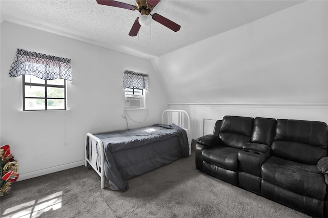 bedroom with ceiling fan, lofted ceiling, carpet, and a textured ceiling