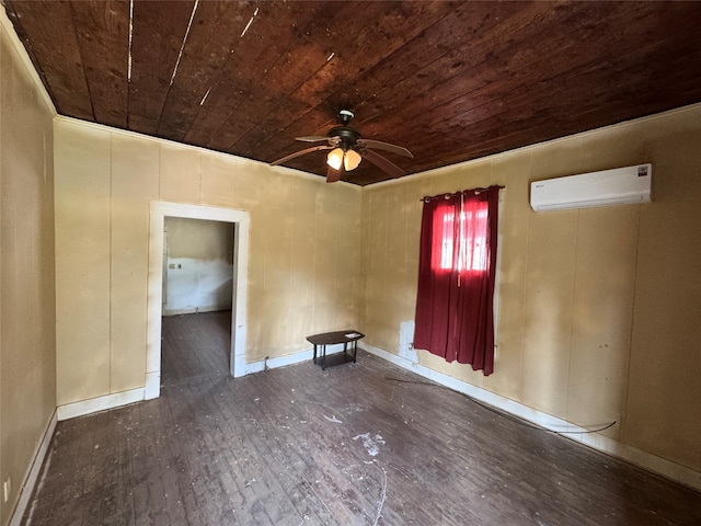 spare room with dark wood-type flooring, wood ceiling, a wall mounted air conditioner, and ceiling fan