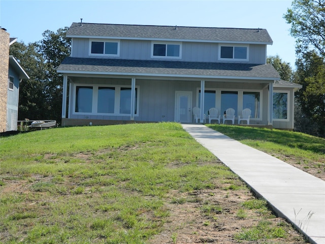 view of front of home featuring a front yard