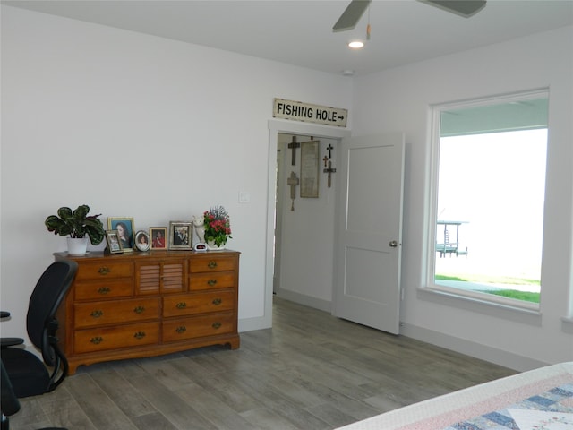 bedroom featuring light wood-type flooring and ceiling fan