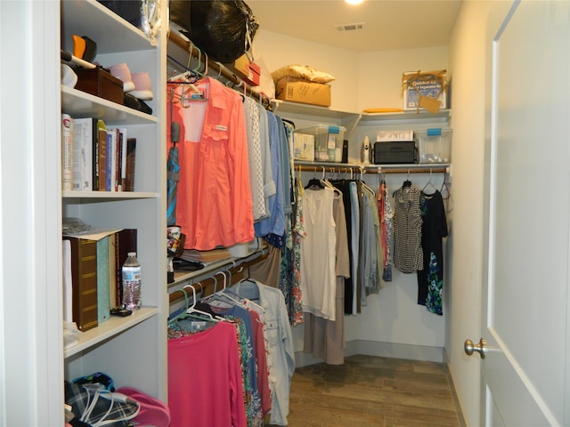 walk in closet featuring hardwood / wood-style flooring