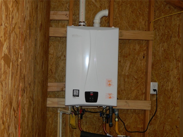 utility room with tankless water heater