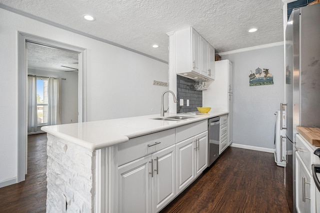 kitchen with sink, stainless steel dishwasher, kitchen peninsula, and white cabinets