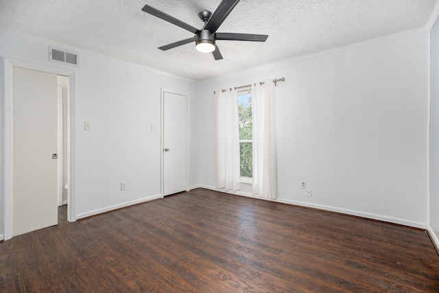 unfurnished room featuring crown molding, ceiling fan, dark hardwood / wood-style flooring, and a textured ceiling