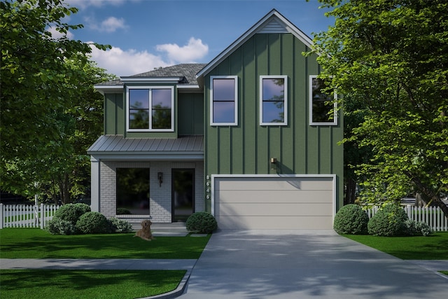 view of front of house featuring a front lawn and a garage