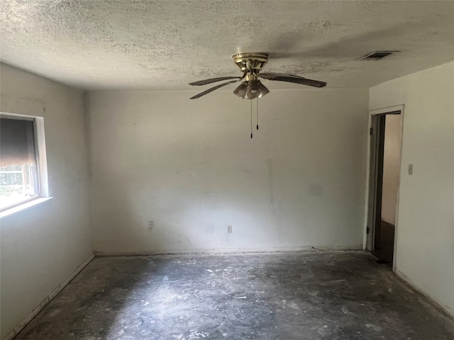 unfurnished room featuring a textured ceiling and ceiling fan