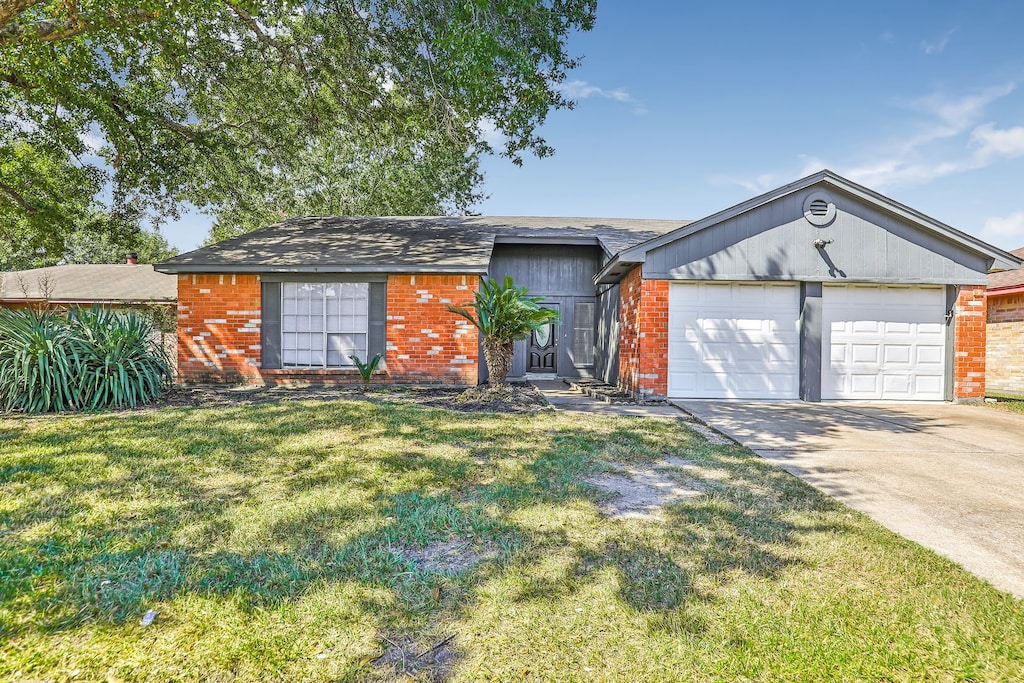 ranch-style house with a front lawn and a garage