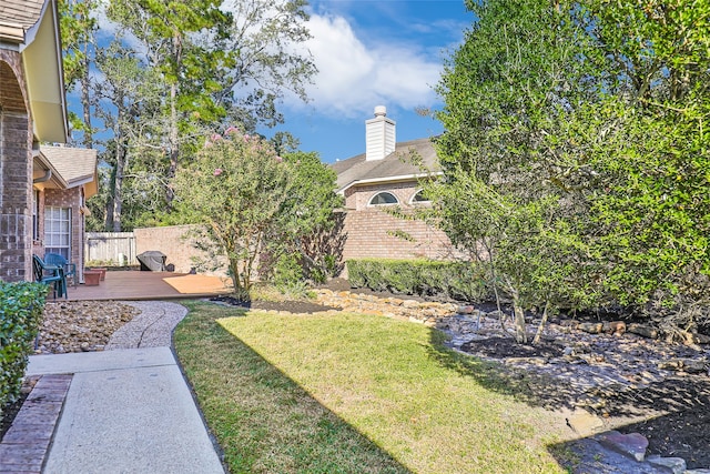 view of yard featuring a deck