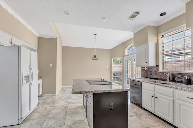 kitchen with a kitchen island, white refrigerator with ice dispenser, black dishwasher, and white cabinetry