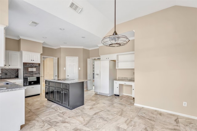 kitchen with black double oven, decorative light fixtures, vaulted ceiling, white cabinets, and a center island