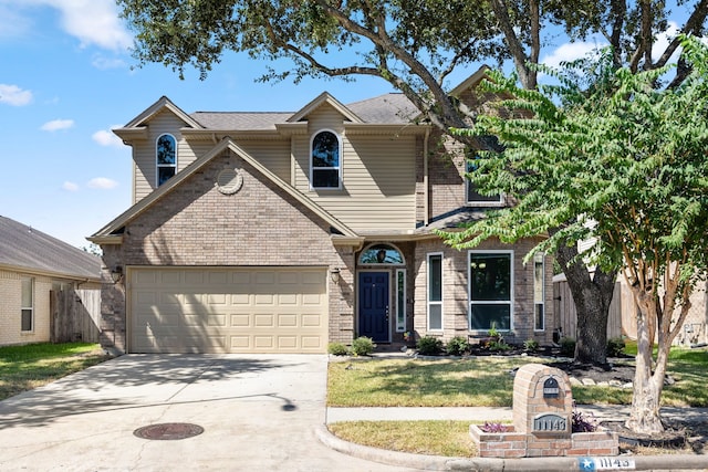 view of front of house with a garage and a front lawn