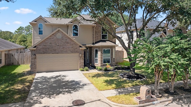 view of front property with a garage and a front yard