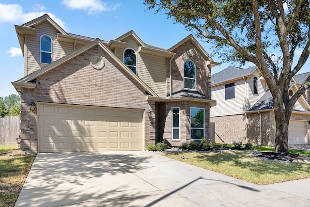 view of front property featuring a front yard and a garage