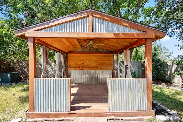 deck with a gazebo and ceiling fan