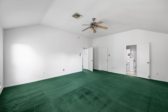 carpeted spare room with vaulted ceiling and ceiling fan