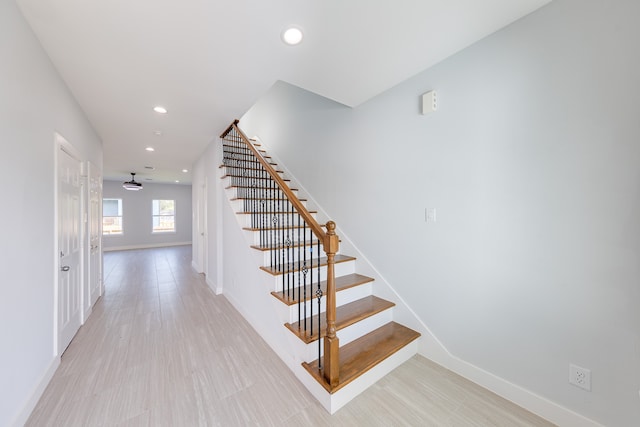 stairs featuring wood-type flooring