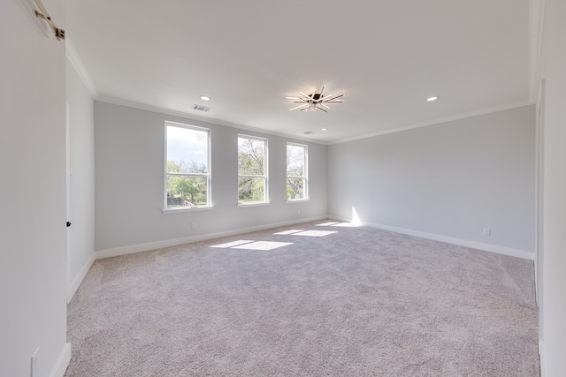 carpeted empty room featuring ornamental molding