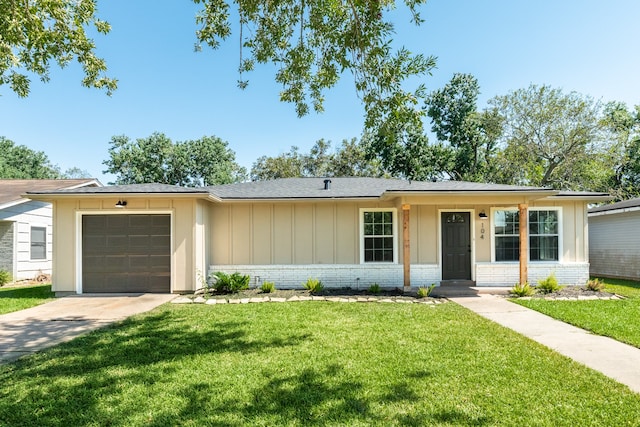 single story home with a garage and a front lawn