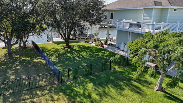 exterior space featuring a patio and a deck with water view