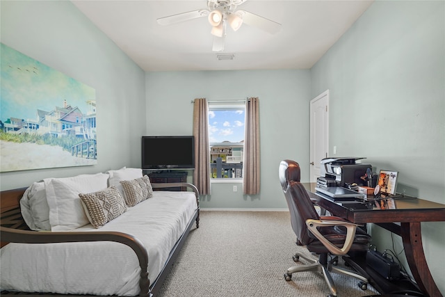 carpeted office with ceiling fan