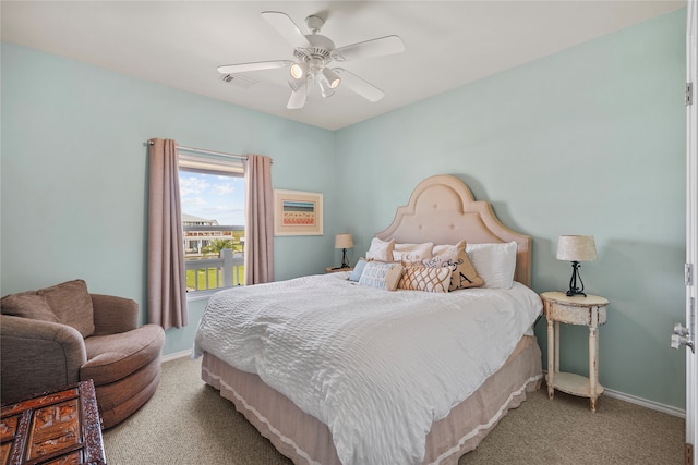 carpeted bedroom featuring ceiling fan