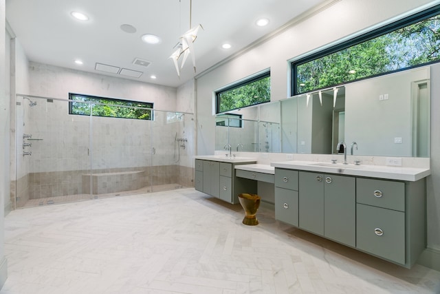 bathroom with an enclosed shower, crown molding, and vanity