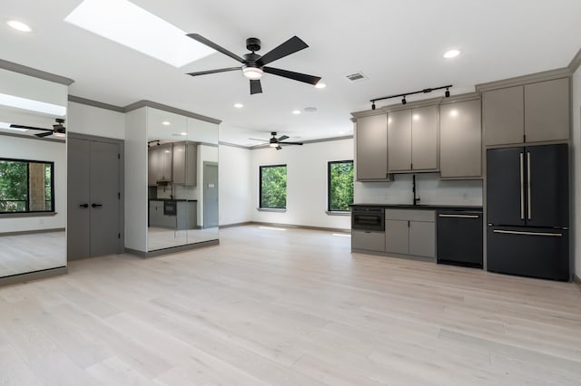 kitchen with gray cabinets, black appliances, and light wood-type flooring