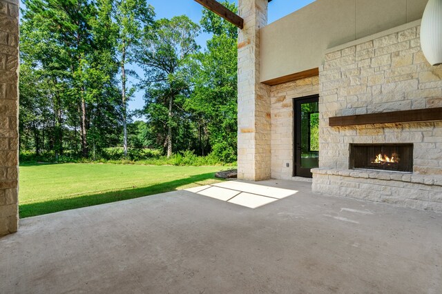 view of patio / terrace with an outdoor stone fireplace