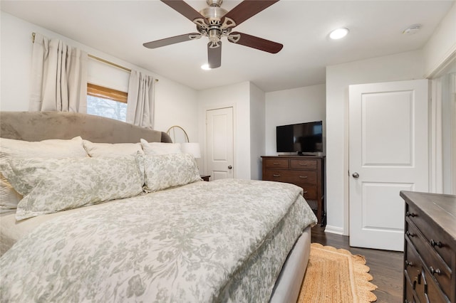 bedroom featuring ceiling fan and dark hardwood / wood-style flooring