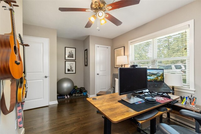 office space with ceiling fan and dark hardwood / wood-style flooring