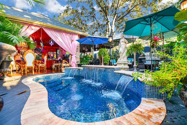 view of swimming pool with a gazebo, a patio area, and pool water feature