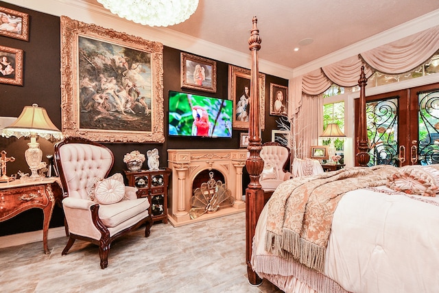 bedroom with french doors and crown molding