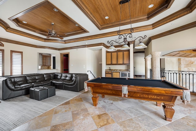 game room with ornate columns, a raised ceiling, and wood ceiling