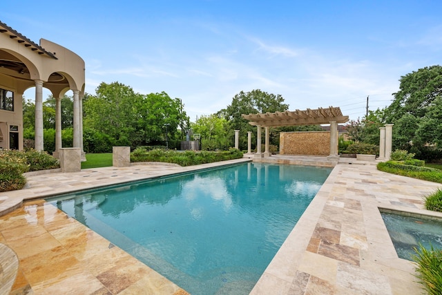 view of pool with a patio and a pergola