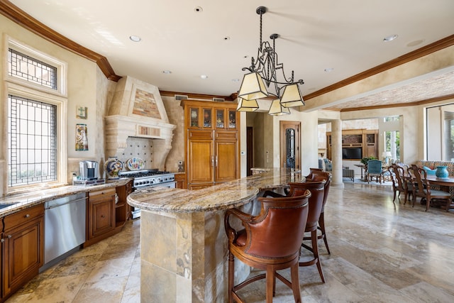 kitchen with crown molding, light stone countertops, stainless steel appliances, and plenty of natural light