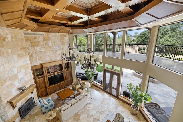 sunroom / solarium with beamed ceiling, french doors, and coffered ceiling