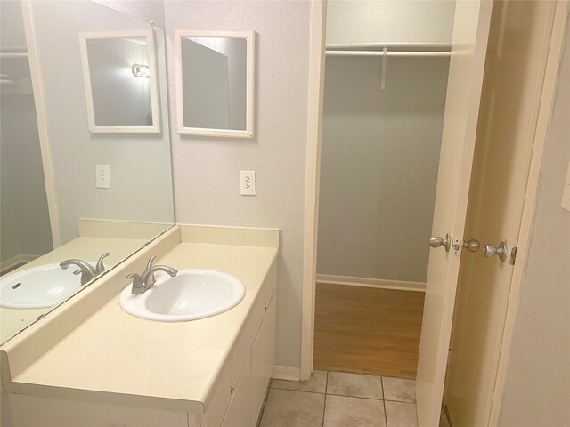 bathroom with hardwood / wood-style flooring and vanity