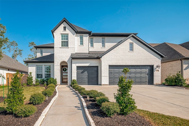 french country inspired facade featuring a garage