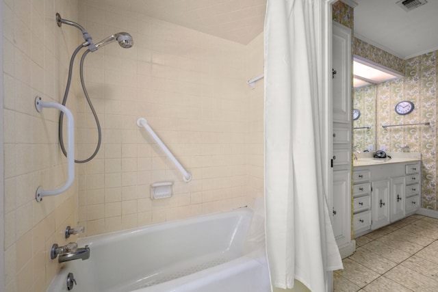 bathroom with tile patterned flooring, shower / bath combo, and sink